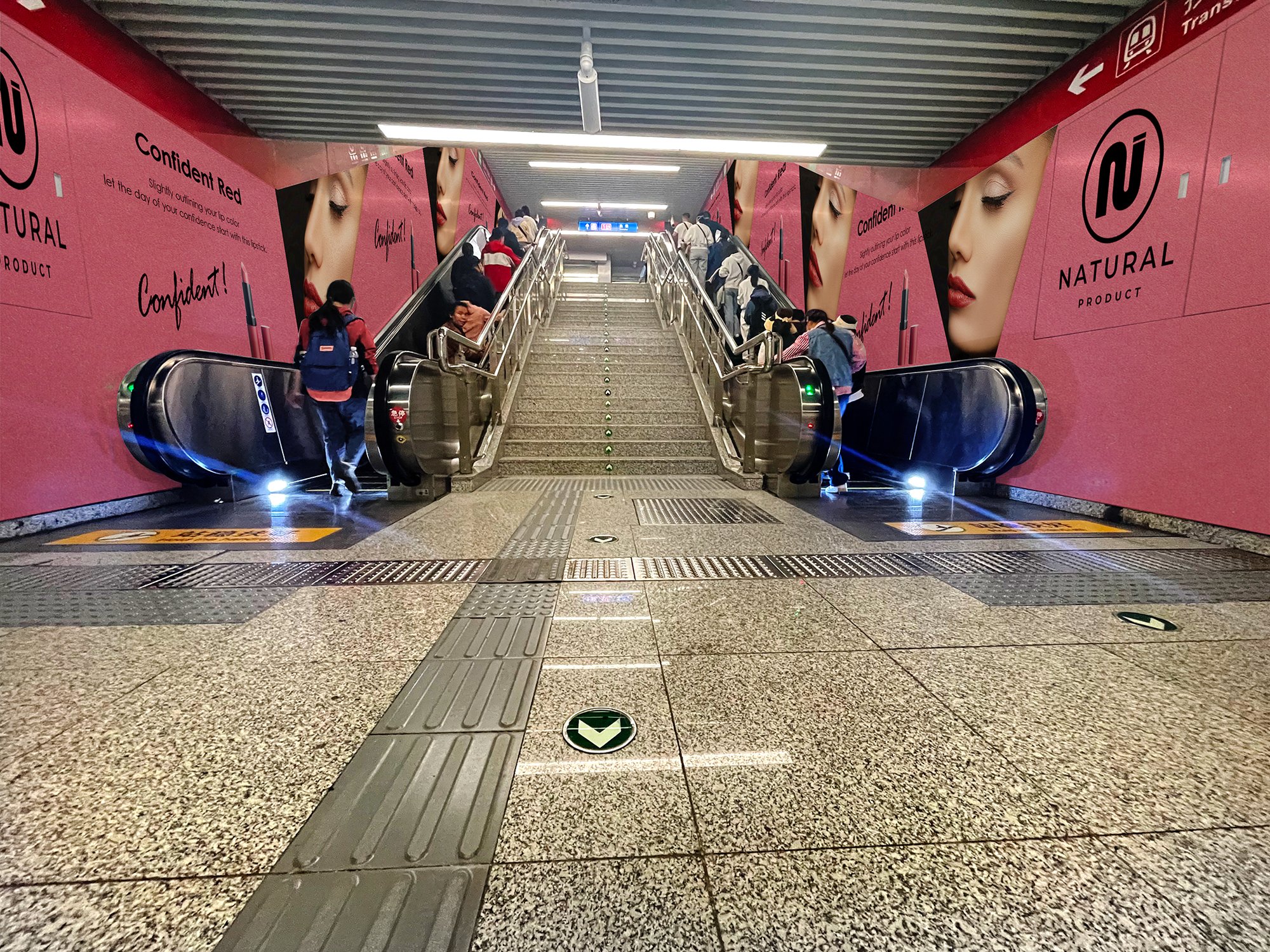 Escalator side-wall wrap in a Beijing metro station
