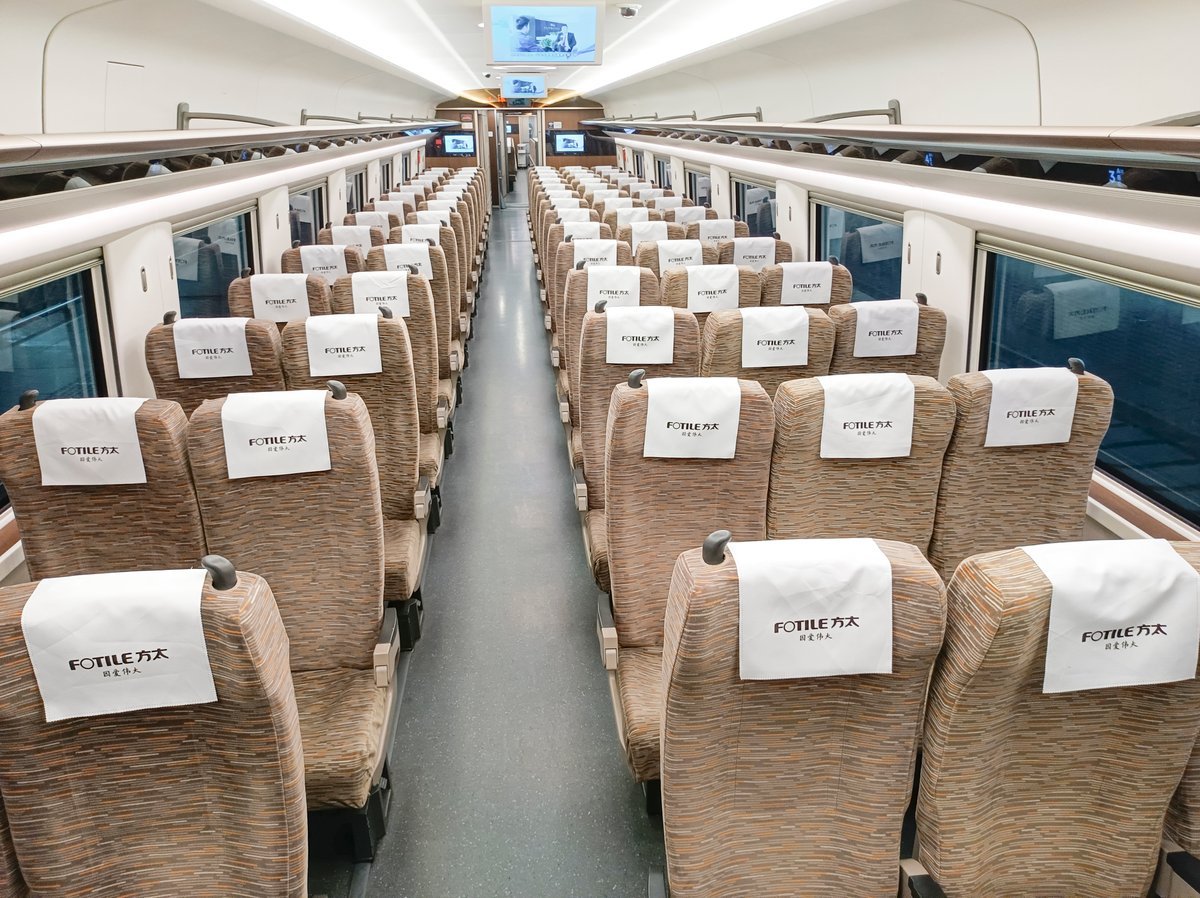 Seat headrest advertising covers a full carriage of seats on a high-speed railway train